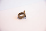 Side view of the vintage turtle ring highlighting its textured, hand-cast bronze band.