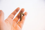 Side profile of the vintage cast bronze chameleon ring with an aged patina.