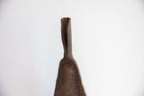 Rustic patina and hand-forged texture on the folded top of the Yoruba bell.