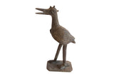 Vintage African bird casting with a textured, patinated finish and stylized details.