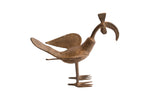 Vintage African curved beak bird casting with a stylized body and rustic metal patina.