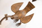 Vintage African curved beak bird casting showing engraved patterns and widespread wings.
