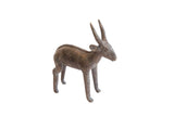 Vintage African antelope sculpture with a dark aged patina and textured back detail.