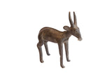Vintage handmade African antelope sculpture with a dark, weathered patina.