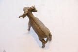 High-angle view of the vintage ram sculpture, highlighting its handmade textured spine.