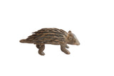 Handmade vintage African porcupine sculpture with a rustic dark patina and textured quills.
