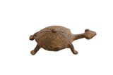 Vintage African tortoise sculpture, dark brown with a textured, carved shell.