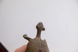 Textured head and neck of vintage African tortoise, showing incised shell patterns.