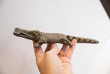 Vintage alligator sculpture held in hand to show its scale and handmade texture.