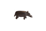 Vintage African hippo figurine with a dark, aged patina and rustic, handmade form.