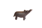 Small vintage African hippo figurine with a dark, textured patina finish.