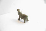 Rear view of the vintage African hippo figurine, showing its stocky form and oxidized patina.