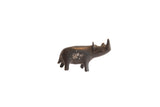 Vintage handmade African rhino figurine with a dark, aged patina finish.