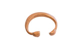 Antique African copper snake cuff bracelet with a hand-formed body and aged patina.