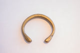 Antique African bronze snake cuff bracelet with a simple open form and smooth, rounded ends.