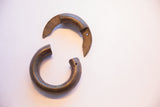 Antique African interlocking bracelet showing its two separable, handcrafted components.