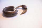 The two hand-forged sections of an antique African interlocking bracelet.