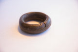 Handmade interlocking joint and aged surface of the antique African bracelet.