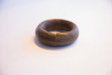 The precisely crafted interlocking seam of the handmade antique African bracelet.