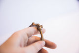 Detailed view of the sculptural, textured surface on the vintage African cuff.