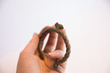 Handmade twisted form and aged patina on a vintage African chameleon cuff.
