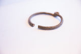 The opening of the vintage African cuff, detailing the rustic texture of the metal.
