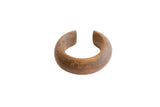 Antique African heavy cuff bracelet with a warm patina and incised geometric scroll patterns.