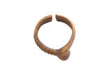 Vintage African cuff bracelet with an aged bronze patina, featuring ribbed and etched details.