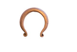 Antique African heavy cuff bracelet with a warm, oxidized patina and coiled terminals.