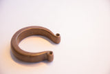 Angled view of the solid antique African cuff showing its smooth, aged patina.
