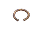 Antique African cuff bracelet with a heavy twist design and dark oxidized silver patina.