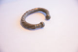 Side profile of the antique African cuff highlighting its twisted design and time-softened patina.