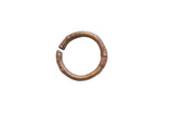 Vintage African bronze cuff bracelet with a weathered patina and simple incised details.