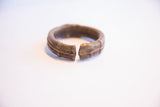 Detailed view of the thick, open ends of the vintage African bronze cuff.