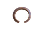 Antique African heavy cuff bracelet with a dark, time-softened patina and incised line details.