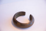 The squared ends and thick profile of the antique heavy cuff bracelet.
