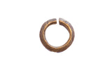 Vintage African bronze alloy cuff bracelet with a textured, hand-etched pattern.