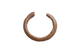 Handmade vintage African bronze cuff bracelet with a textured surface and etched details.