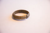 Etched patterns and side opening on a vintage African bronze cuff bracelet.
