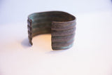Side view of the vintage African cuff showing the opening and inner patina.