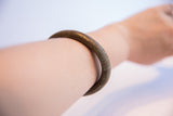 Vintage African lined cuff bracelet shown on a forearm to illustrate its fit.