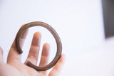 Side profile of the vintage African cuff highlighting the ridged edge and opening.