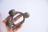 Vintage Lobi bell cuff bracelet held in hand showing its sculptural form.