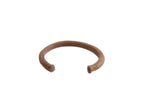Vintage African copper alloy cuff bracelet with a rustic, handmade texture and warm patina.