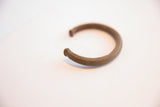 Profile view of the vintage African cuff showing its textured band and flared ends.