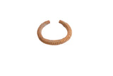 Vintage African cuff bracelet with a ridged texture and an oxidized, rust-colored patina.