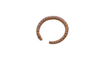 Vintage African cuff bracelet with a segmented design and aged metal patina.