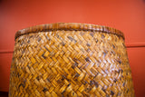 Hand-woven diagonal bamboo pattern and dark brown rim of the antique basket.