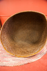 Interior view of the large antique bamboo basket, showcasing its hand woven texture.