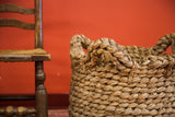Nubby texture and intricate braided handle of the vintage woven basket.